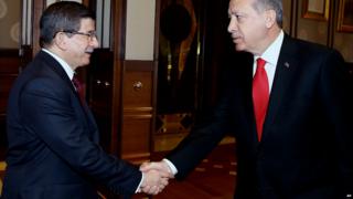 Ahmet Davutoglu (left) and Recep Tayyip Erdogan shakes hands before a meeting in Ankara - 25 August 2015