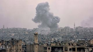 Smoke rising from buildings in Aleppo's eastern Karm al-Jabal neighbourhood