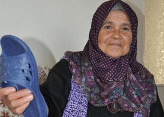 Turkish woman with slipper (pic courtesy of DHA)