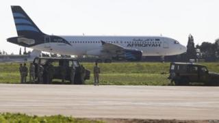 The Afriqiyah Airways plane was surrounded by Maltese troops on the runway
