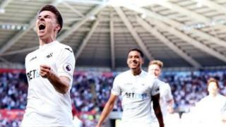 Tom Carroll celebrates goal