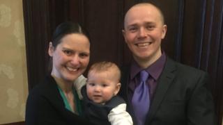 Lee Bennison pictured with baby son Osian and partner Delyth Jones