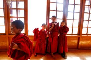 Young monks take a break from their studies inside Thiksey Monastery in Ladakh, India.