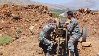 Syrian Arab News Agency image shows Syrian army soldiers during a artillery operations in Zabadani. 9 July 2015
