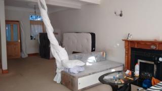 Several beds in a living room