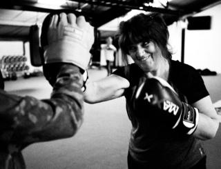 A woman practices her boxing.