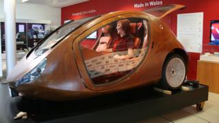 A prototype for a three-wheeled wooden car