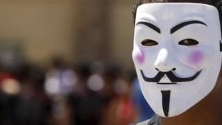 Man wearing Anonymous mask