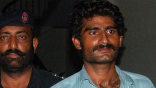Murder suspect Waseem (R)