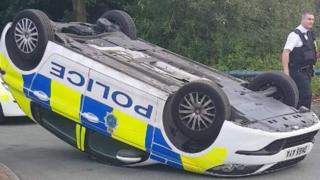 Police car on its roof