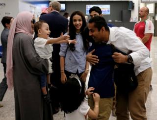 Trump travel ban: Judge expands definition of 'close relative' 10 A family hug each other at Washington Dulles Airport on 26 June, 2017, after the U.S. Supreme Court granted parts of the Trump administration's emergency request to put its travel ban into effect