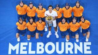 Roger Federer holds the Australian Open trophy