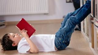 Boy reading a book