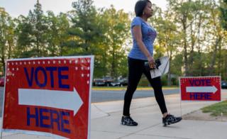 A voter arrives to her polling place to vote in the Maryland presidential primary election at Skyline Elementary School in Suitland, Maryland, USA, 26 April 2016.