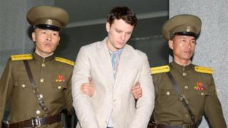 Otto Warmbier with North Korea police (16 March 2016)