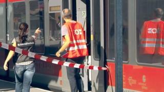 Forensic scientists at Salez station inspect the train involved in the 13 August attack