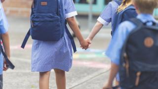 Generic stock image of school children in a playground (anonymous)