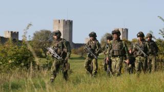 This picture taken on 14 September 2016 shows Swedish military patrolling outside Visby, on Gotland island, Sweden