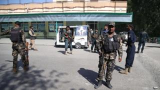 Afghan security officials inspect the scene of a bomb blast in Bahsood district of Nangarhar province, Afghanistan, on 30 April 2018