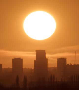 Sunset behind buildings
