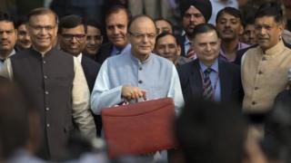Indian Finance Minister Arun Jaitley, centre, leaves for annual budget presentation at parliament in New Delhi, India, Monday, Feb. 29, 2016