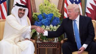 Qatar's Emir, Sheikh Tamim Al Thani, shakes hands with US President Donald Trump in Saudi Arabia (21 May 2017)
