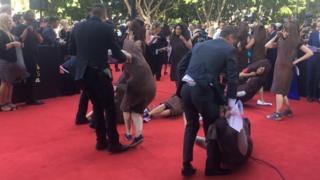 Women stage a 'sausage protest' on the red carpet