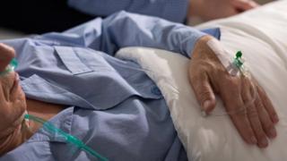 Man in hospital bed