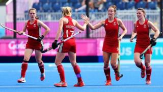 Four members of the Wales women's hockey team