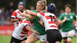 Alison Miller of Ireland is tackled by Mayu Shimizu of Japan during the Womens Rugby World Cup 2017