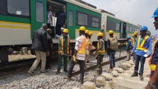 Workmen along the track in Nigeria