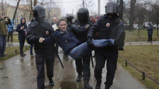 Officers from the Russian interior ministry detain a protester in St Petersburg, April 29, 2017.