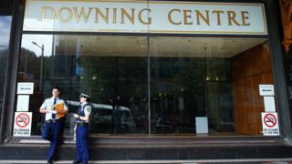 Two police officers stand outside Sydney's Downing Centre, where the trial was held.