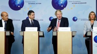 Boris Johnson speaks at a joint news conference in Brussels with French Foreign Minister Jean-Yves Le Drian (L), Germany's Sigmar Gabriel (2L) and EU foreign policy chief Federica Mogherini (R)