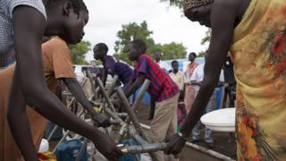 South Sudanese refugees collect water at the Kule camp for internally displaced people at the Pagak border crossing in Gambella, Ethiopia, 10 July 2014