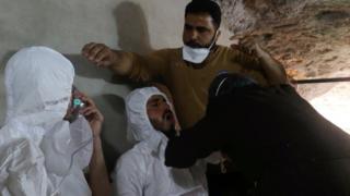 Men receive treatment after a gas attack in the Syrian town of Khan Sheikhoun