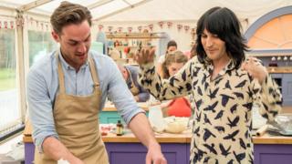 Noel Fielding with baker Tom in The Great British Bake Off
