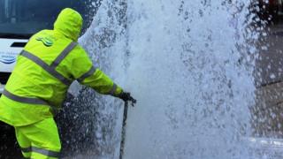 Water emanating from hydrant