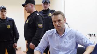 Alexei Navalny (right) speaks after a hearing in a court in Moscow. Photo: 12 June 2017