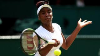 This file photo of Venus Williams shows the tennis athlete hitting a tennis ball
