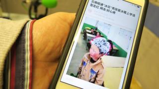 人民日報客戶端上刊登的「冰花男孩」王福滿照片(BBC中文網圖片12/1/2018)