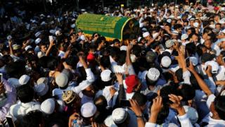 Supporters carry the coffin of Ko Ni, after he was shot dead, in Yangon, Myanmar, on 30 2017