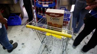 A box of Kellogg's Corn Flakes on a shopping trolley inside a shop in Caracas, Venezuela May 15, 2018