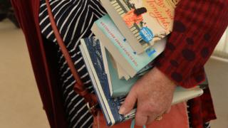 Woman carrying books