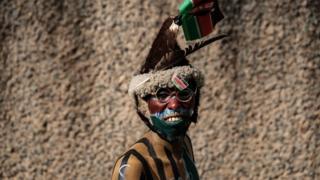 A supporter of Kenya's Gor Mahia poses before the friendly football match Kenya"s Gor Mahia vs England"s Hull City at the Kasarani stadium in Nairobi on May 13, 2018.