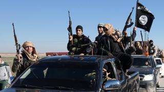 Islamic State militants ride in convoy in Tal Abyad, Raqqa province, Syria (file)