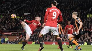 Wayne Rooney kicking ball