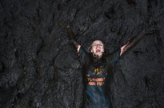 A woman in the mud
