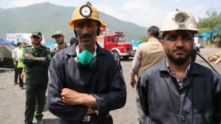 Handout photo from Iranian presidency shows coal miners and rescue workers outside Zemestan-Yurt mine following deadly explosion (7 May 2017)
