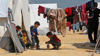 Children play at a camp for displaced Syrians in al-Bil